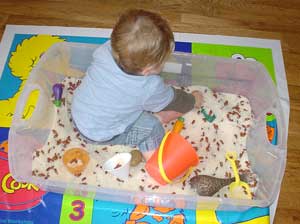 Child in sensory bin