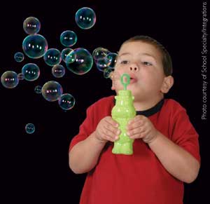 Child blowing bubbles